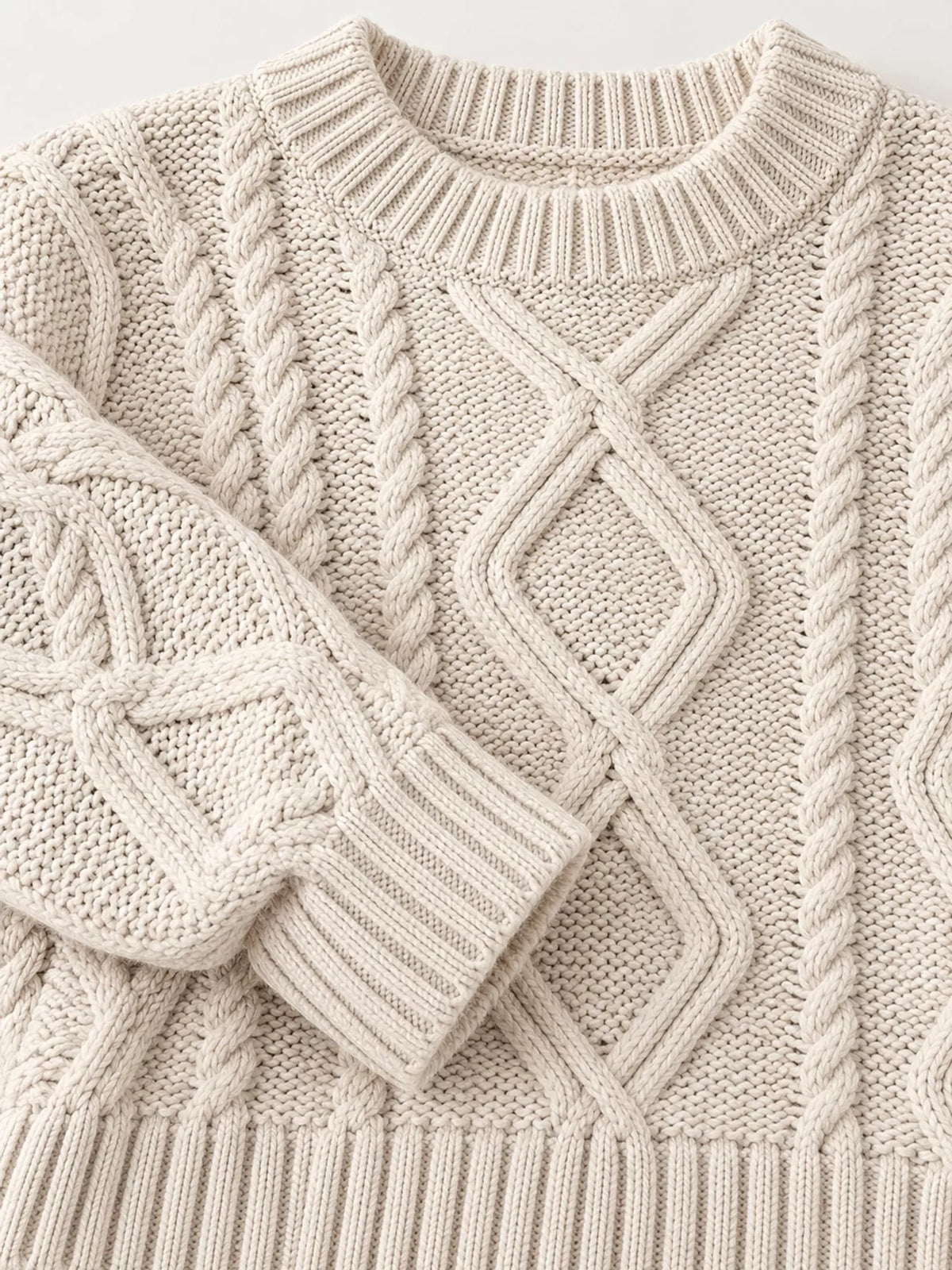 Apricot cable-knit round neck sweater, detail view