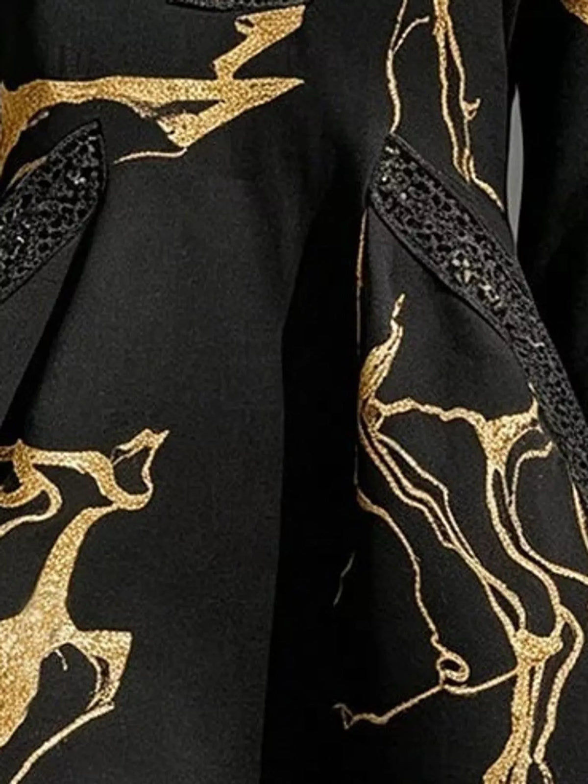 Black notched 3/4 sleeve mini dress, close-up of the print and pocket trim