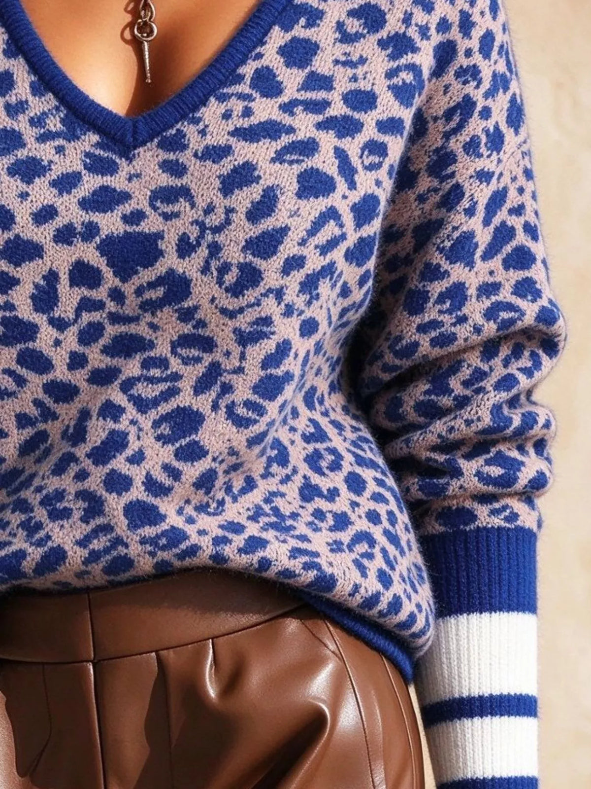 Women's Leopard V-Neck Sweater with Striped Cuffs in blue leopard — cuff detail view
