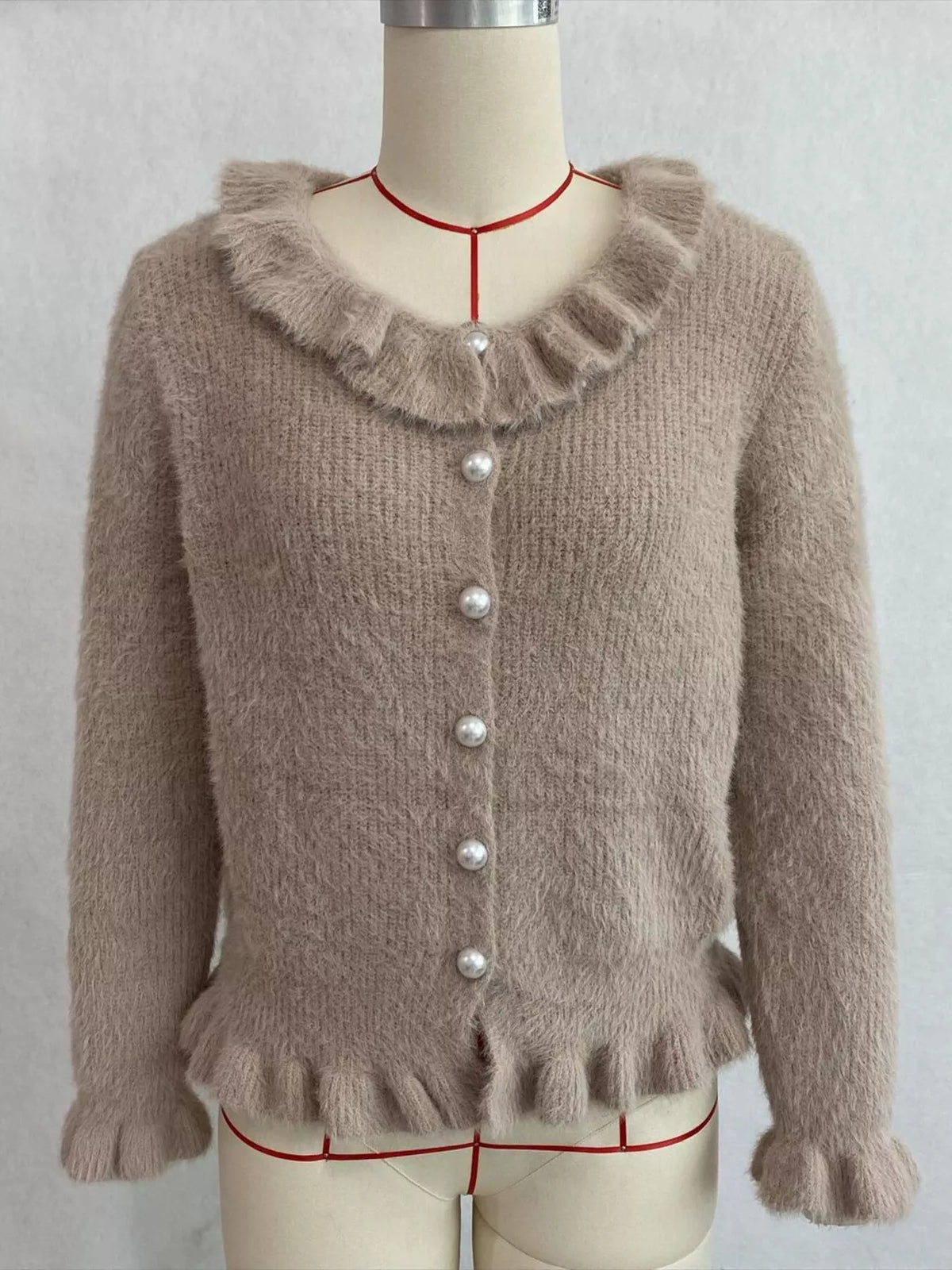 Taupe fuzzy ruffle-trim button-front cardigan, front on dress form.