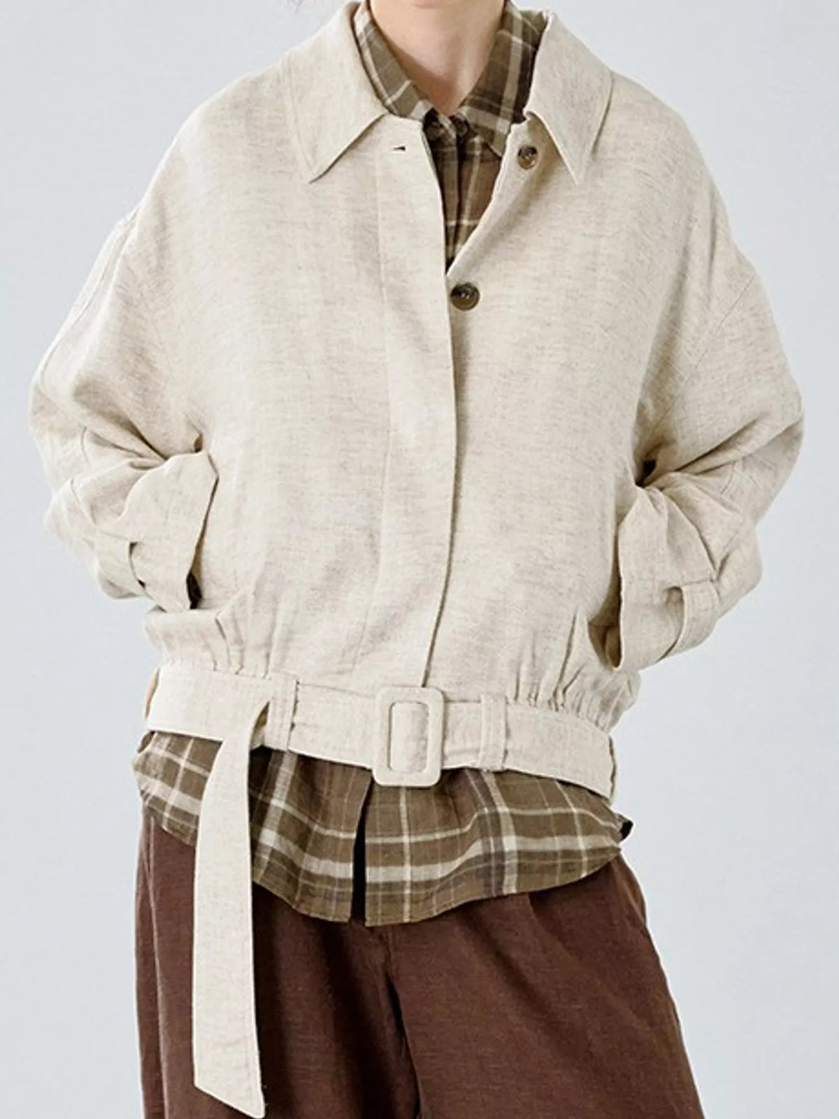 Cream belted dropped shoulder jacket — front view