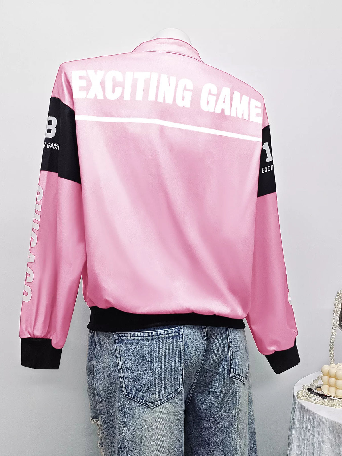 Pink and white letter-print zip-front jacket, back on mannequin