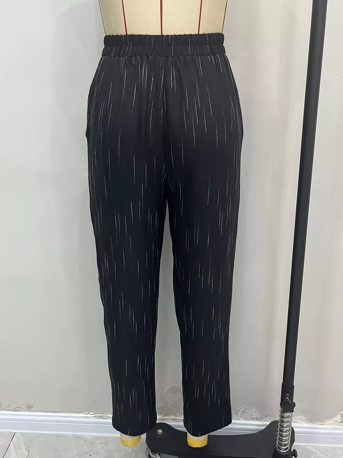 Black loose fit cropped pants, back view