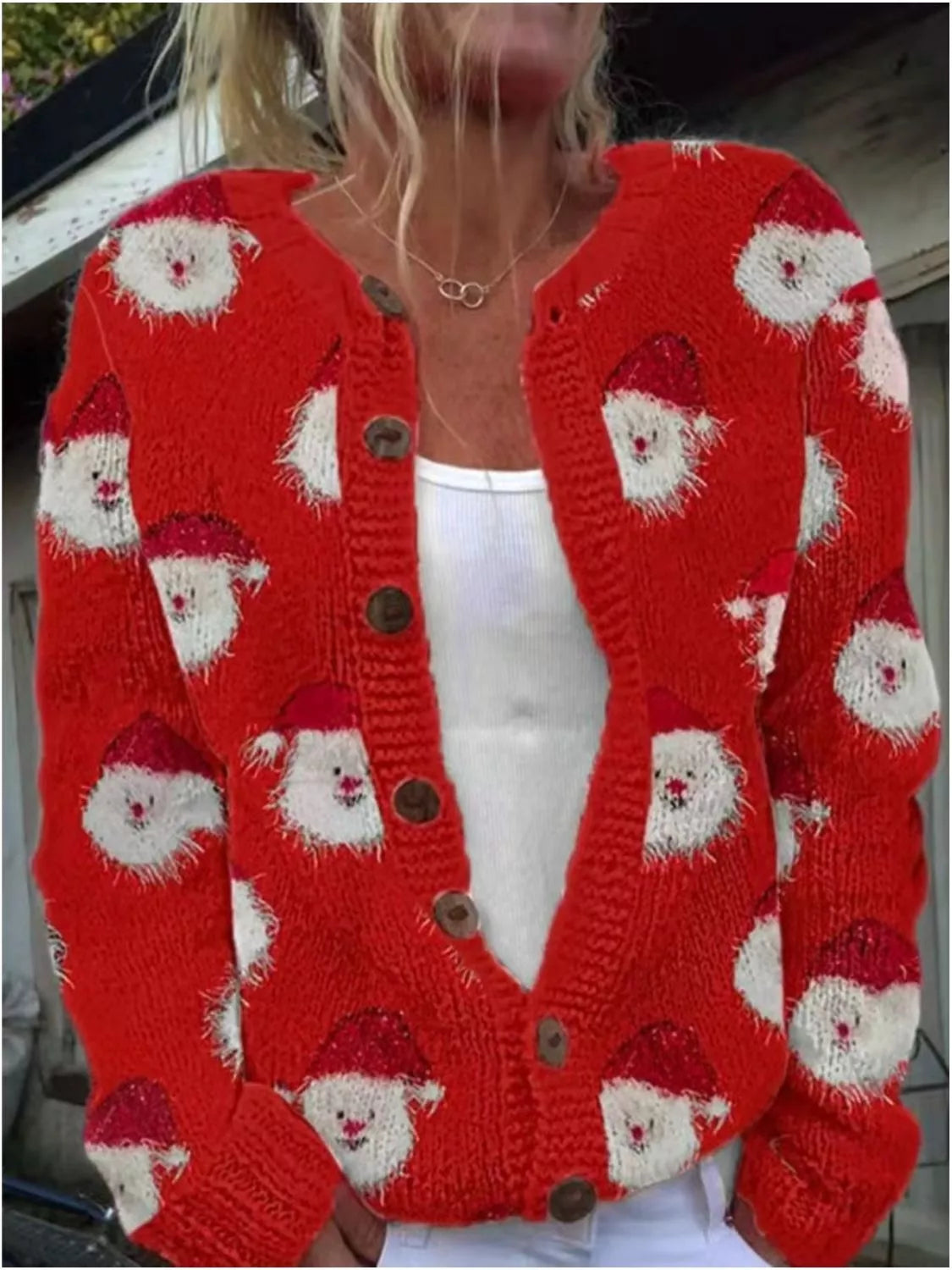 Christmas pattern button-down cardigan in red, front view with Santa motifs
