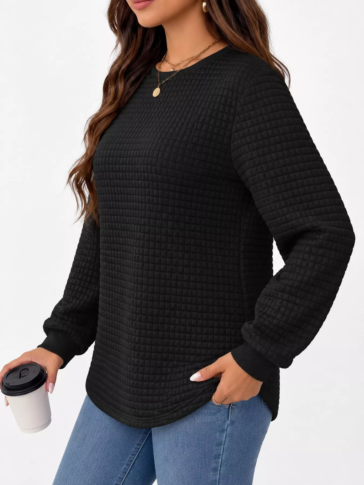 Black waffle knit sweatshirt with curved hem, side view