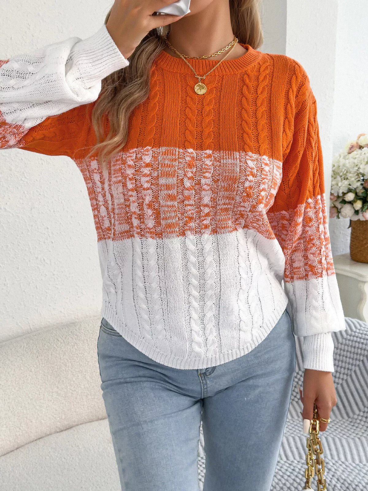 Orange color block cable knit sweater