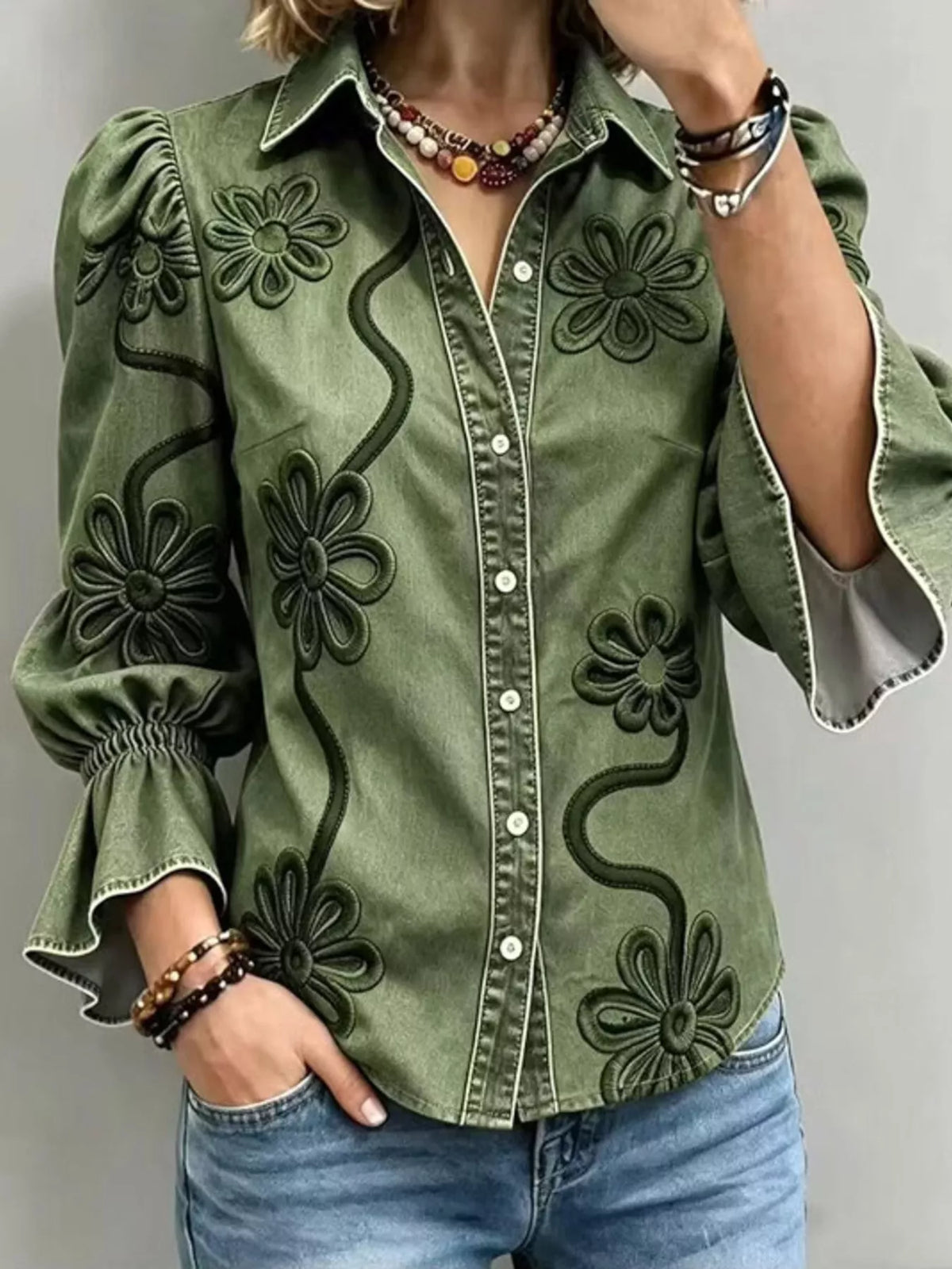 Green floral-embroidered button-down shirt, front view.