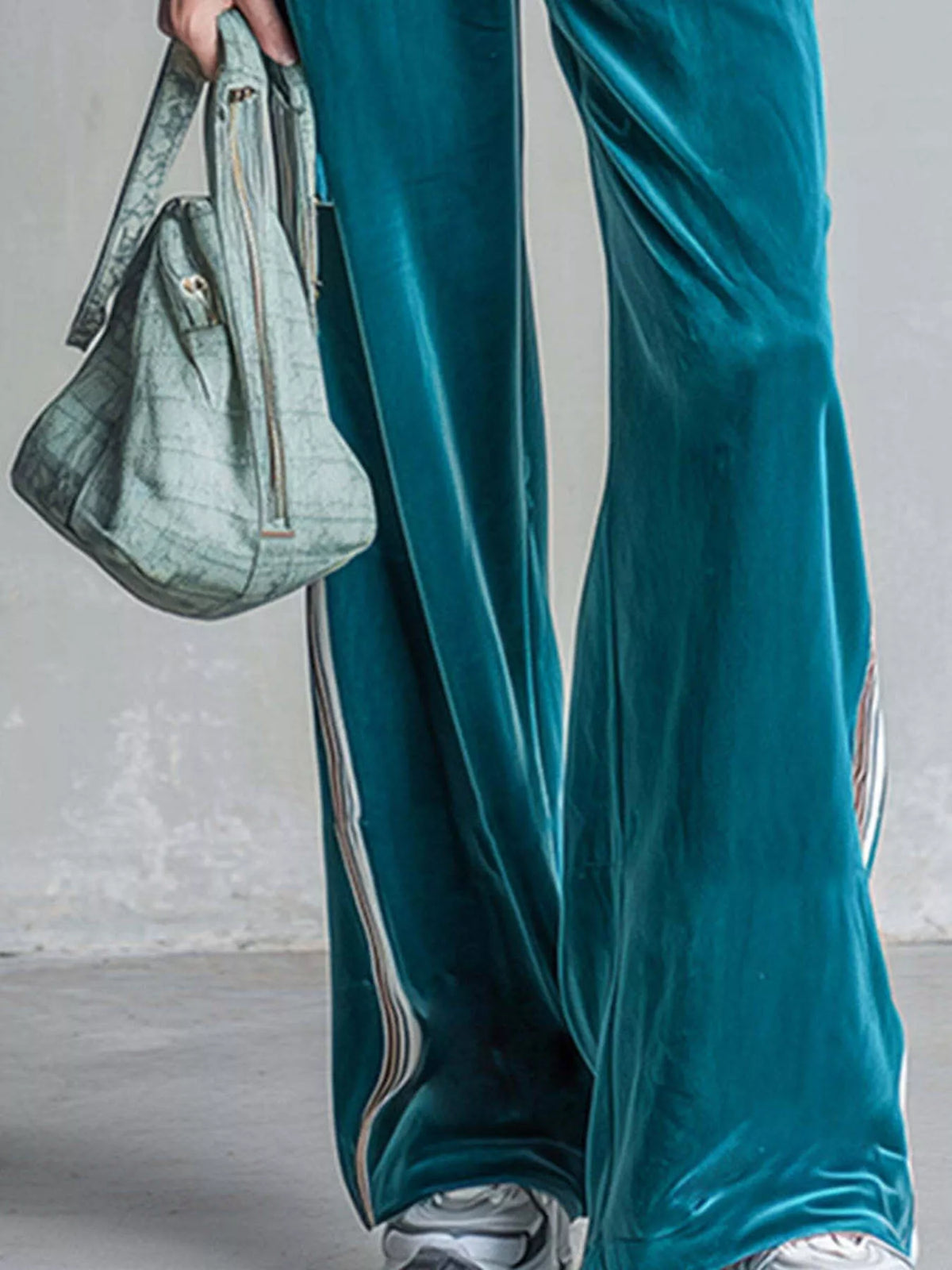 Teal striped half-zip top and pants set, pants and striped side trim detail