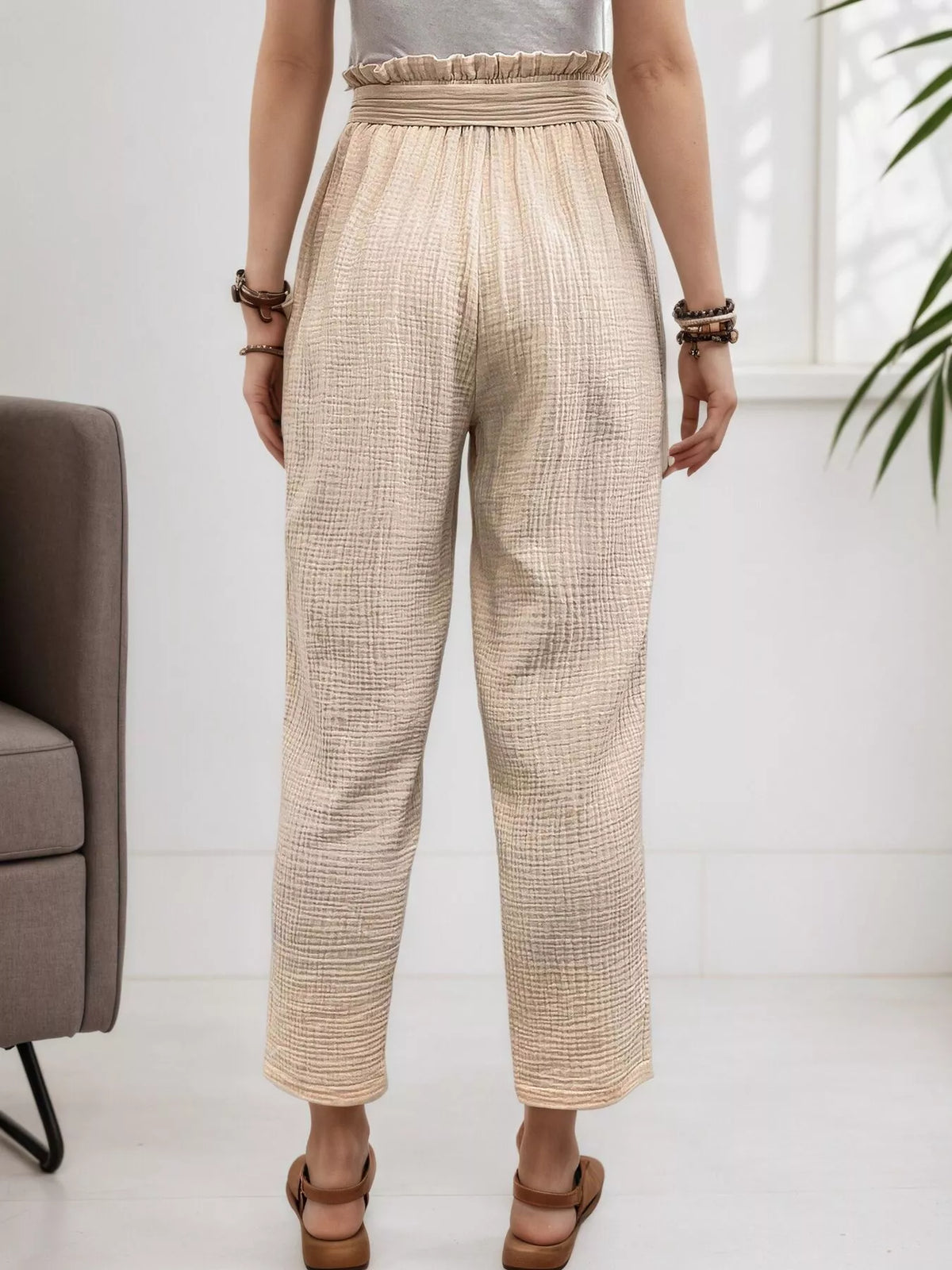 Beige high waisted paperbag waist textured casual pants, back view