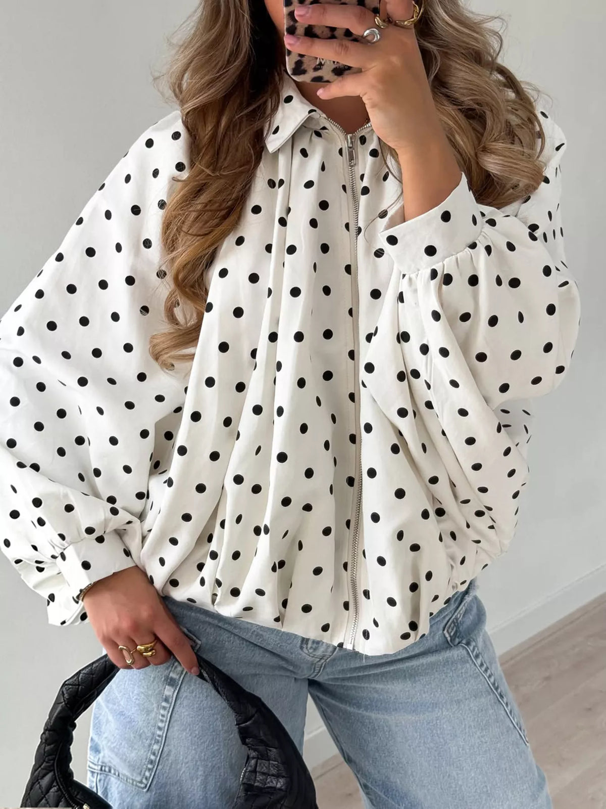 White polka-dot zip-front blouse