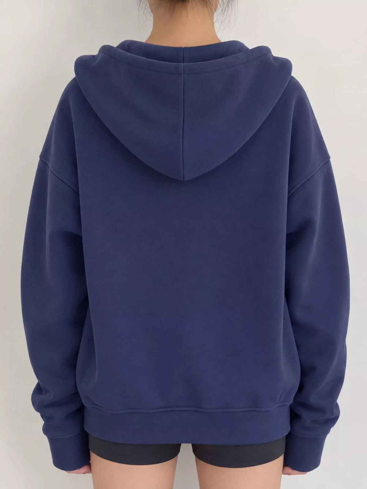 Women's Zip-Up Dropped Shoulder Hoodie in blue — back view