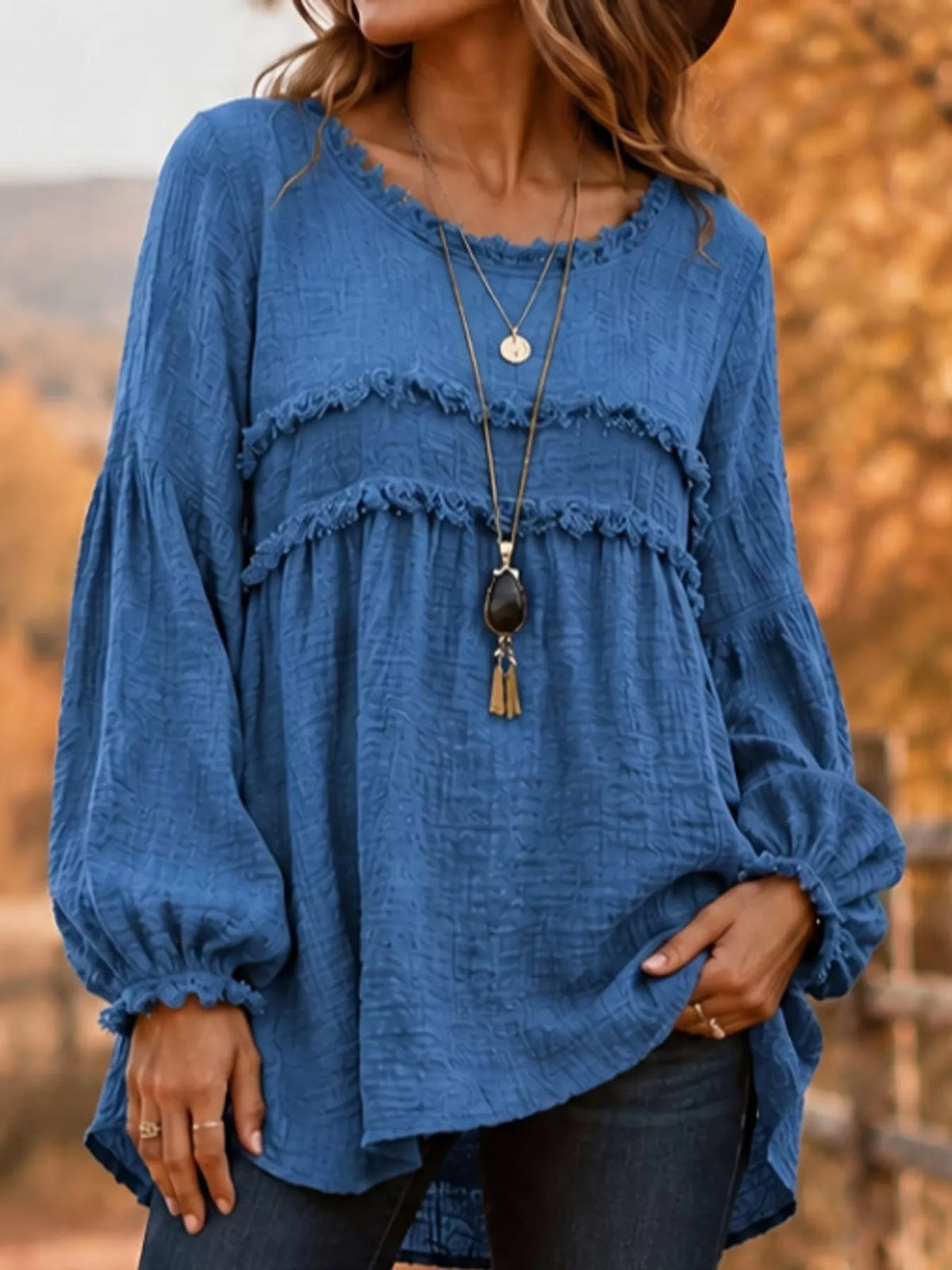 Blue textured frayed-trim peplum blouse