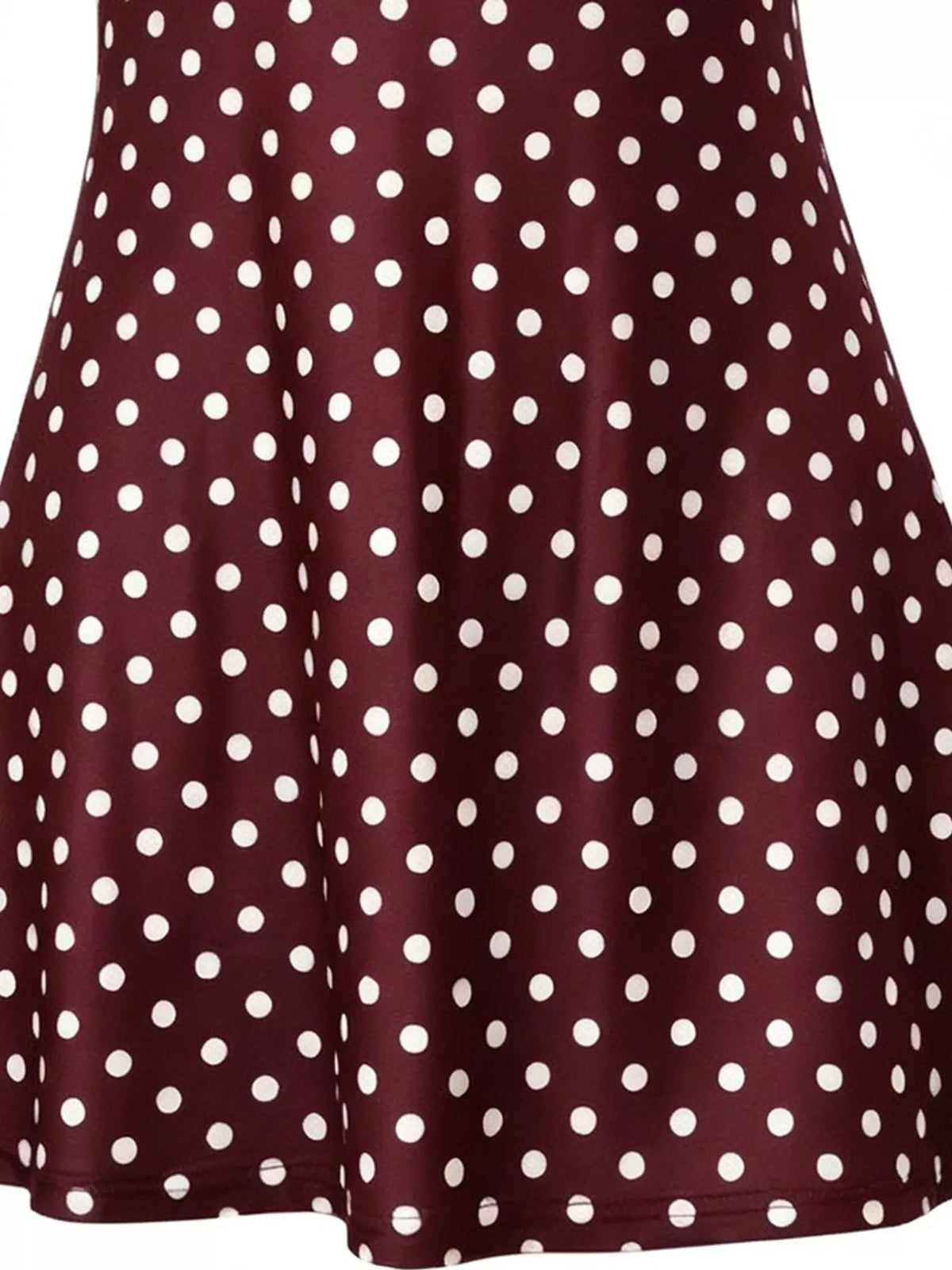 Brown and white polka dot halter neck mini dress, detail view