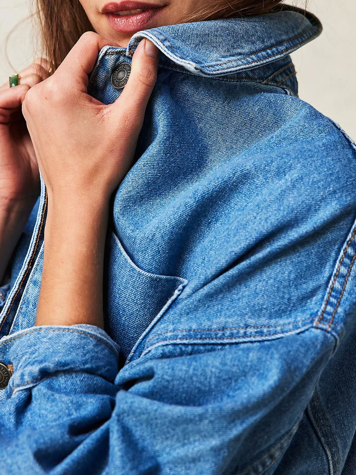 Blue button up long sleeve denim jacket, detail view
