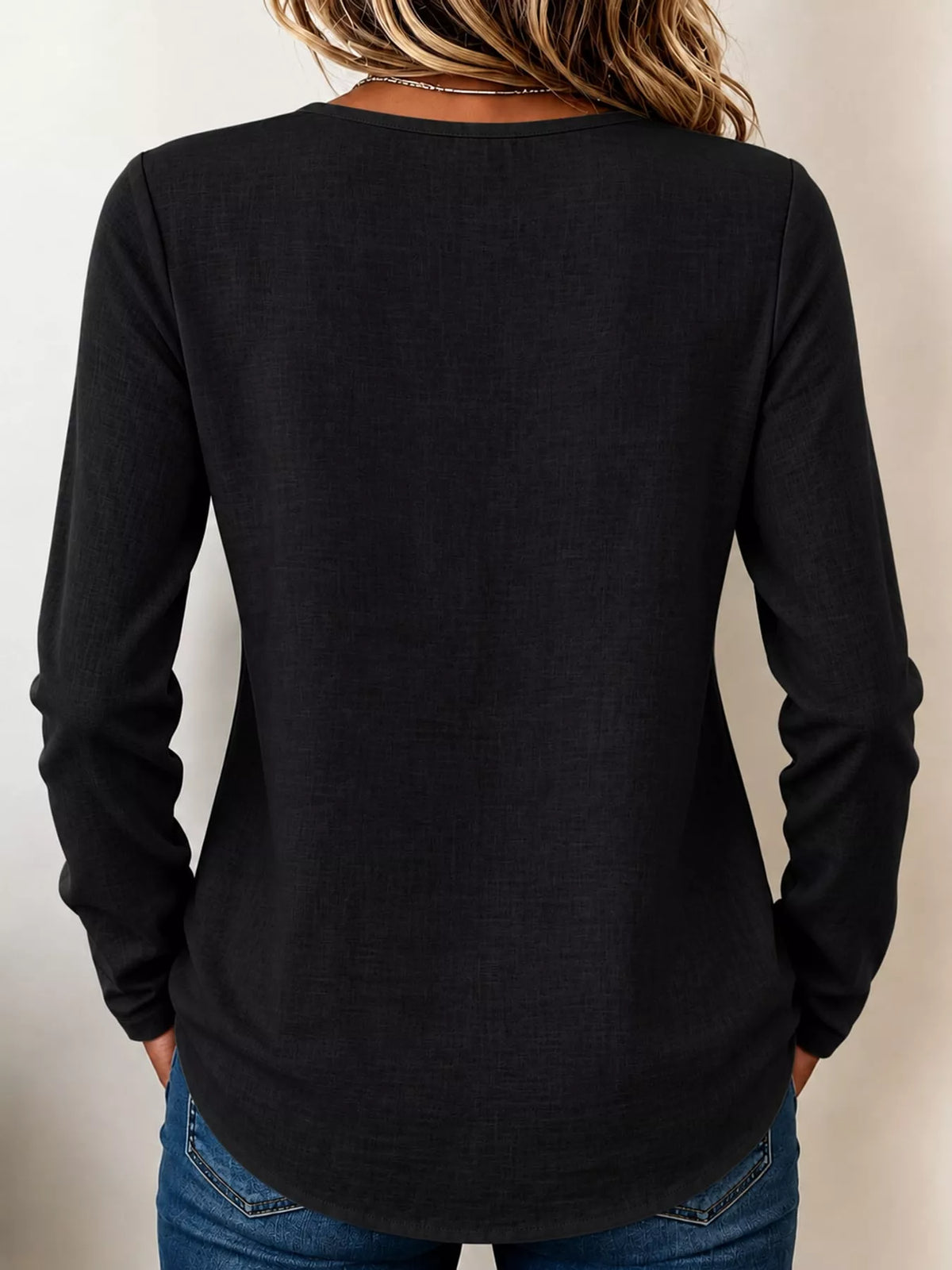 Black long sleeve decorative button blouse, back view