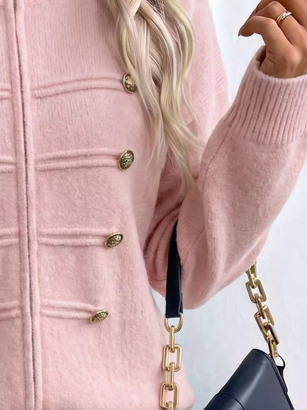 Pink zip-up long sleeve cardigan with decorative buttons, zipper and decorative button detail