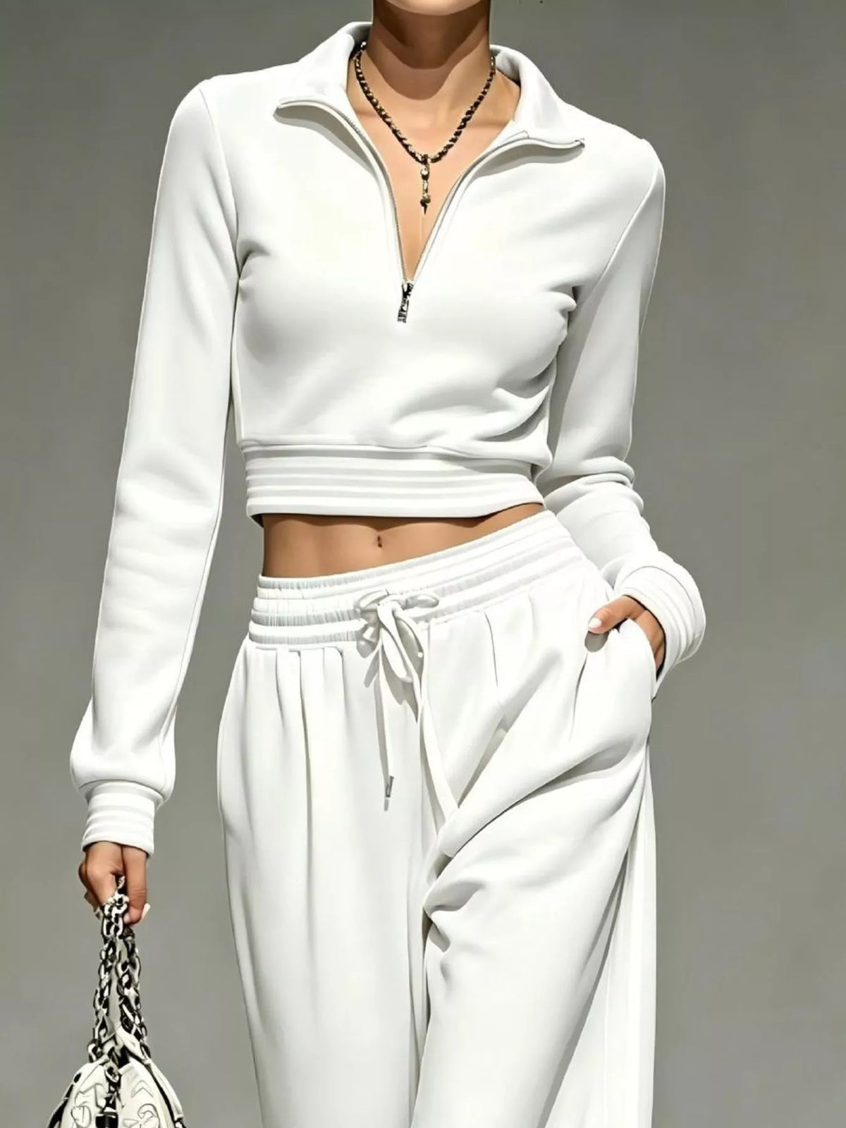 White half-zip crop top and pants set, zip neckline and waist detail