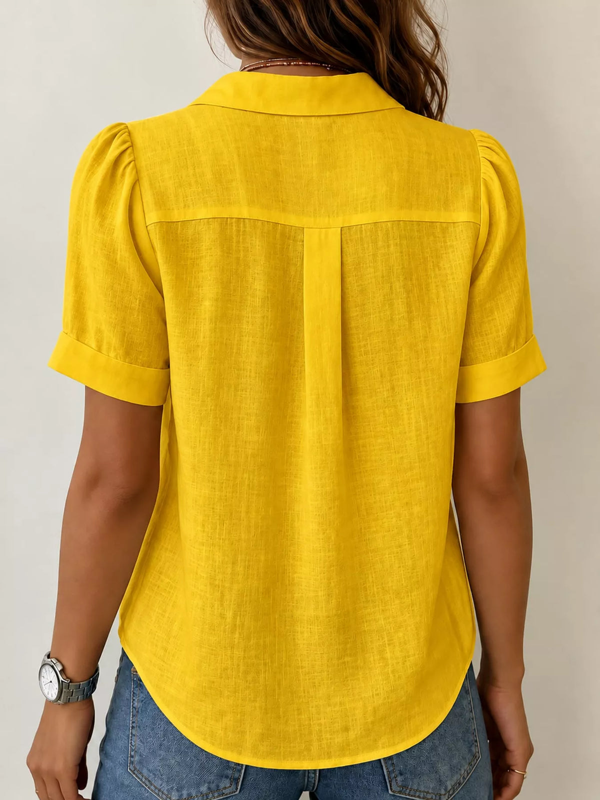 Yellow button up short sleeve shirt, back view