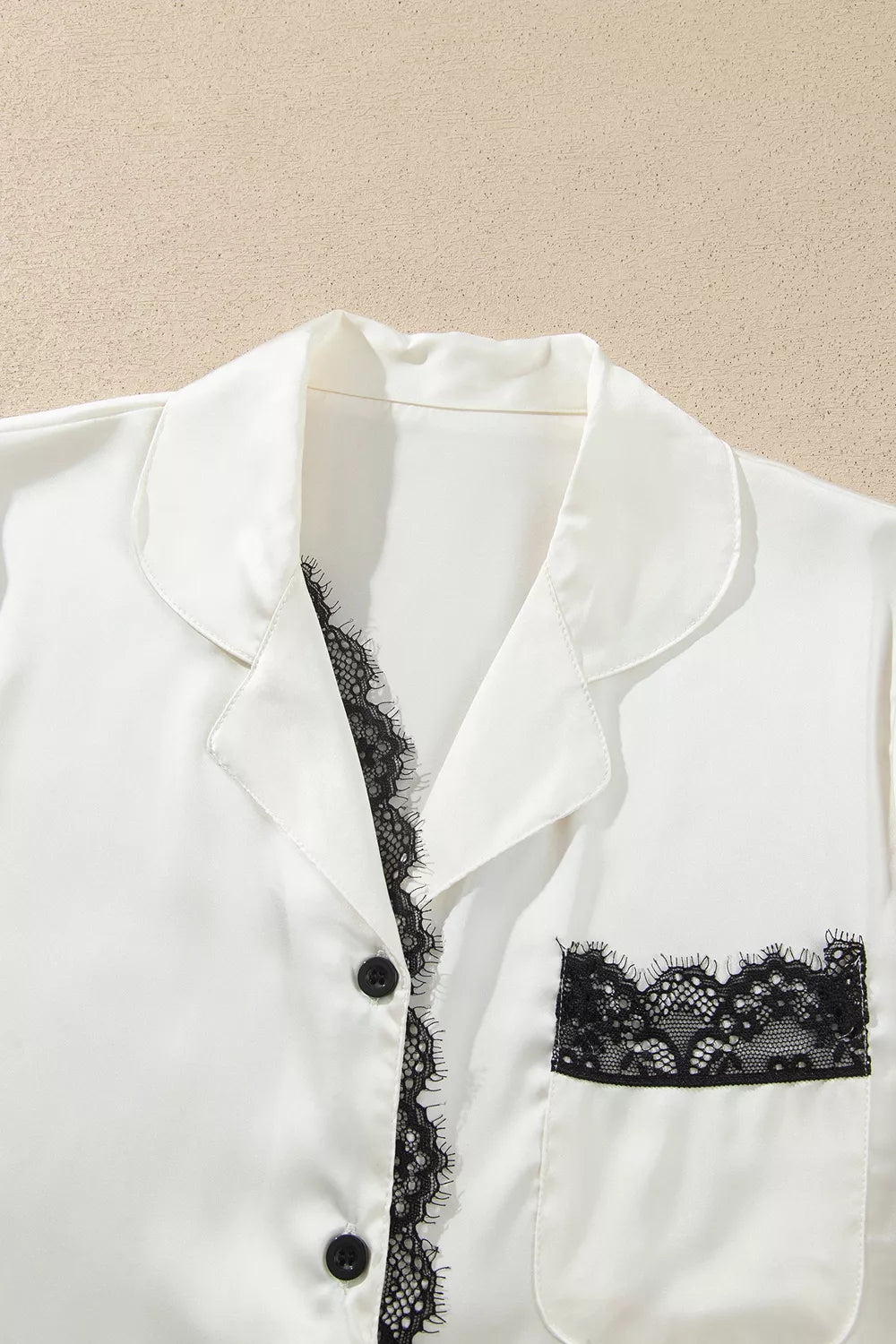Ivory lace-trim button-front pajama set, collar and lace trim detail.