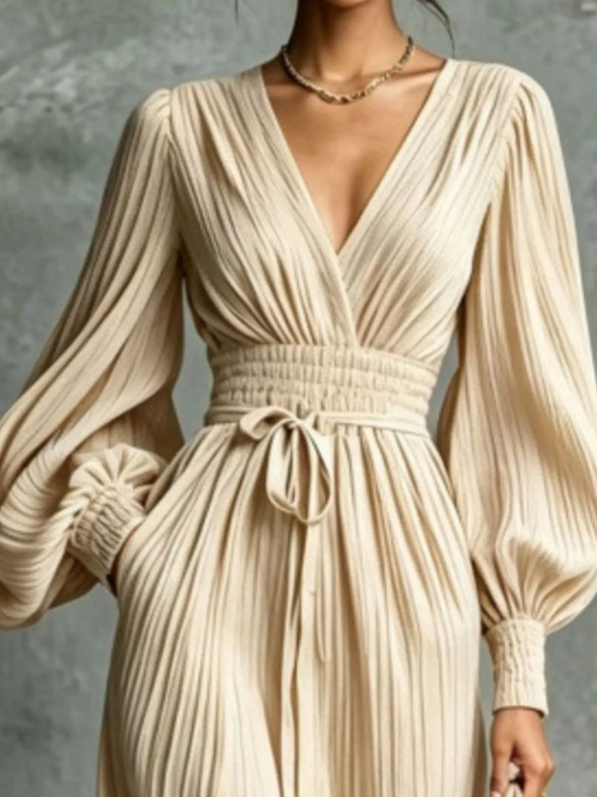 Cream pleated v-neck tie-waist maxi dress, pleated bodice and tie-waist detail.