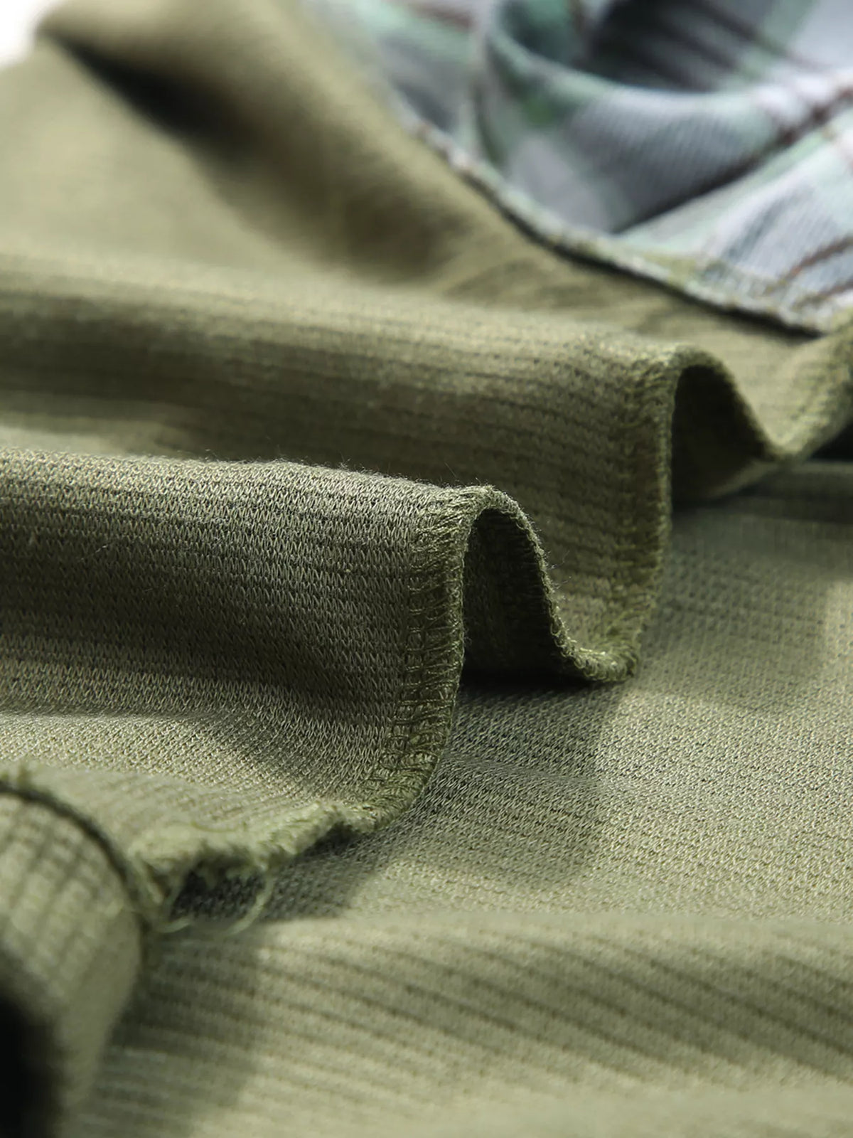 Plaid-patch top, hem texture detail