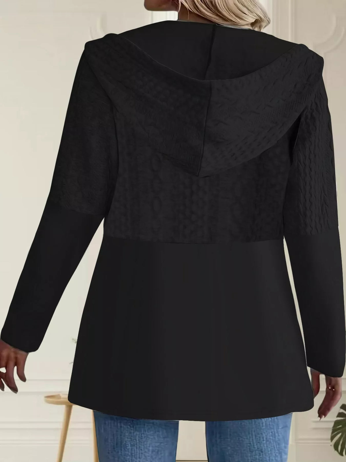 Black hooded zip-up jacket, back view