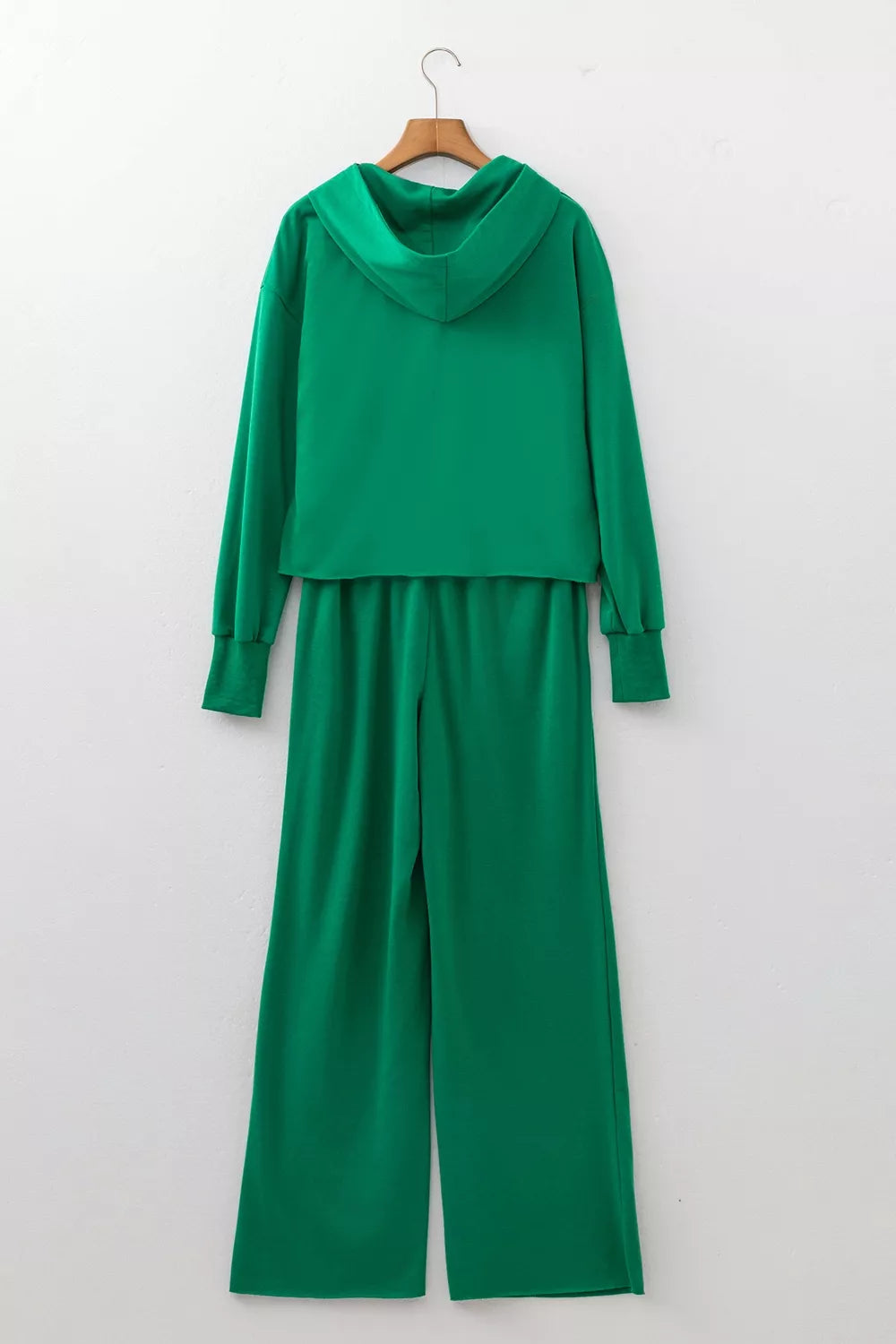 Green hooded top and wide-leg pants set, back on hangers
