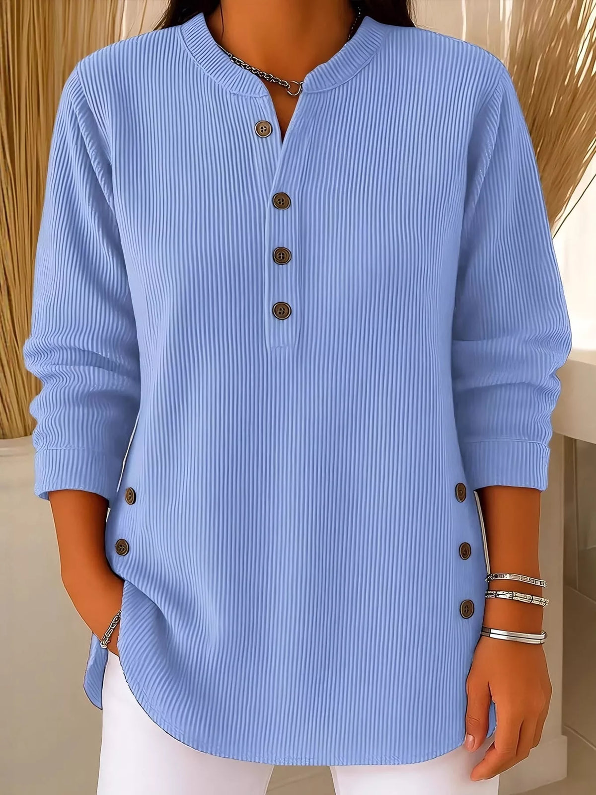 Light blue button detail long sleeve top, front view