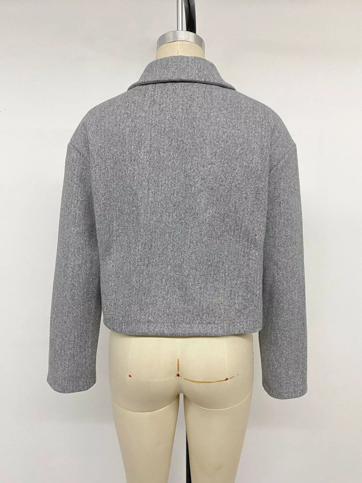 Gray zip-up cropped shacket, back on mannequin