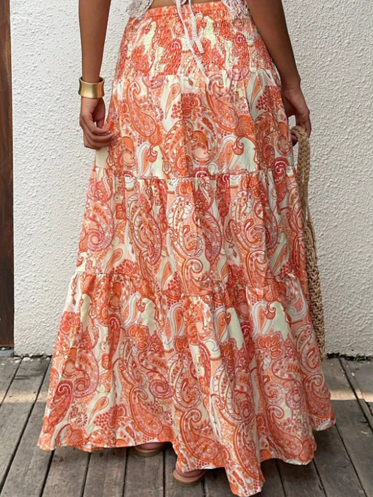 Women's Paisley Print Tiered Maxi Skirt in orange and cream — back view