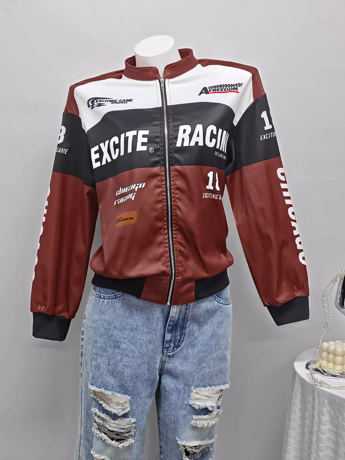 Burgundy and white letter-print zip-front jacket, front on mannequin