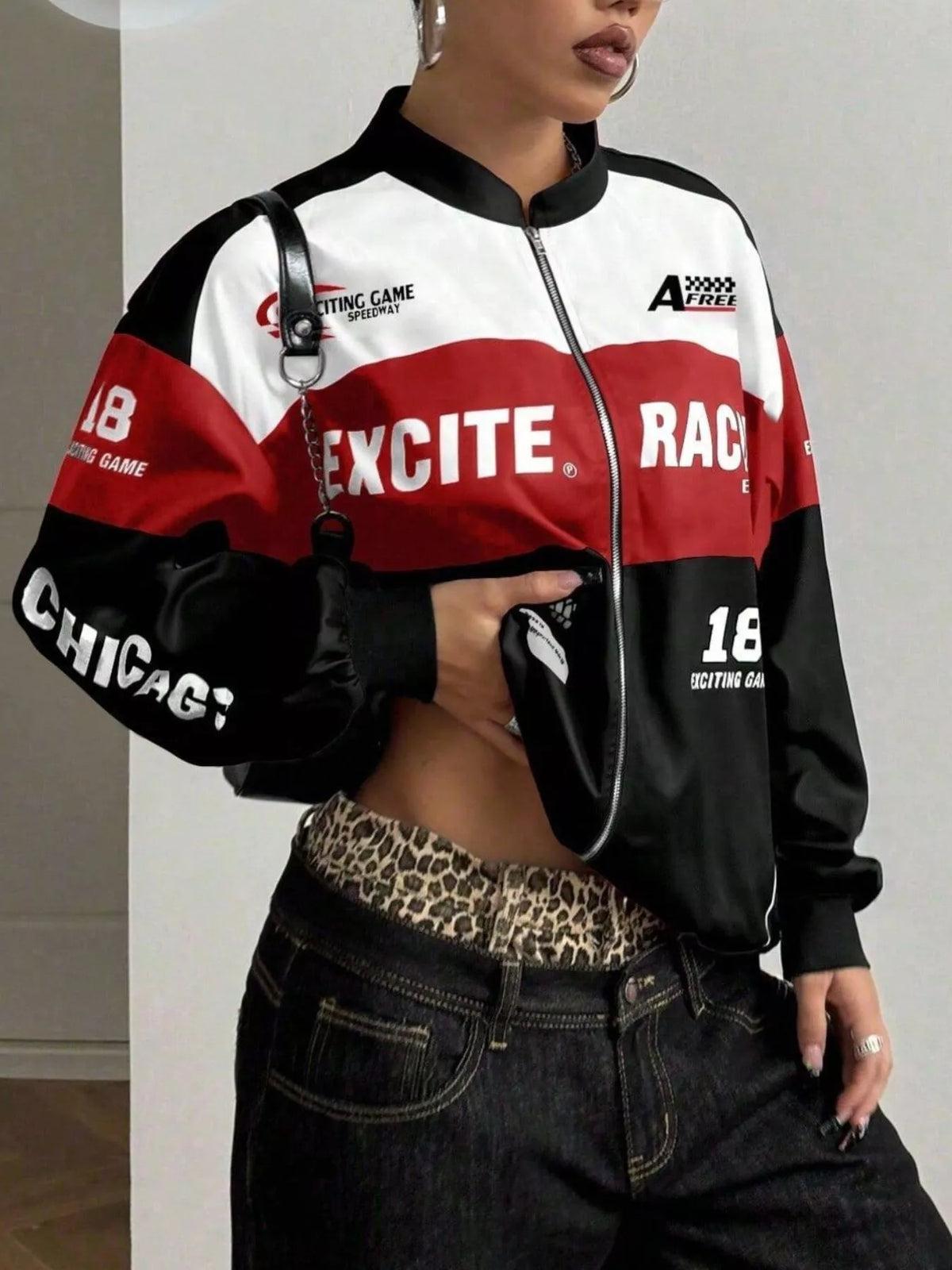Black and red letter-print zip-front jacket, partly zipped front view