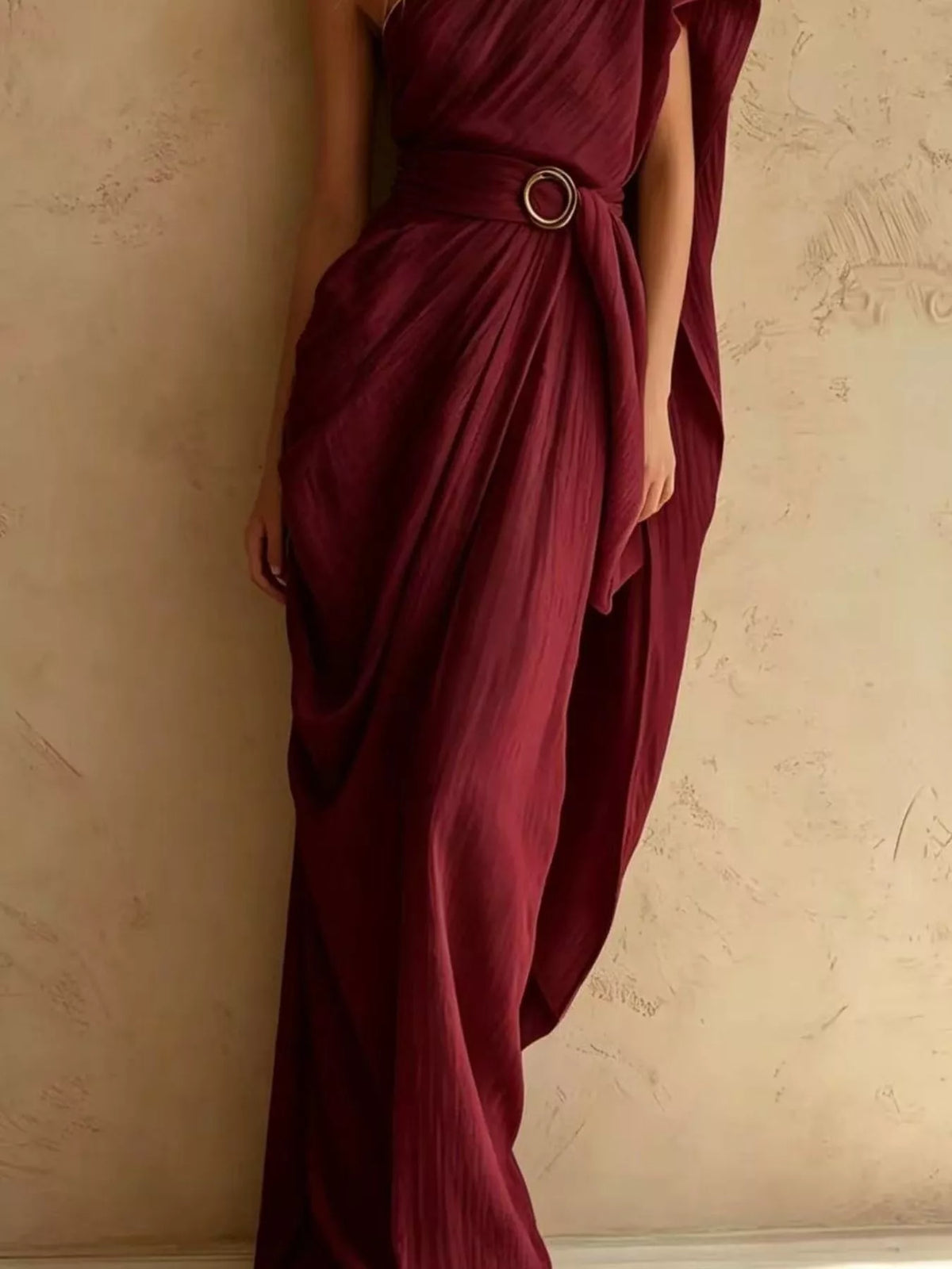 Burgundy one-shoulder draped maxi dress, waist buckle detail