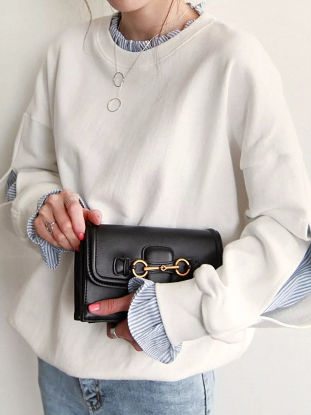 White crewneck sweatshirt with striped ruffle cuffs