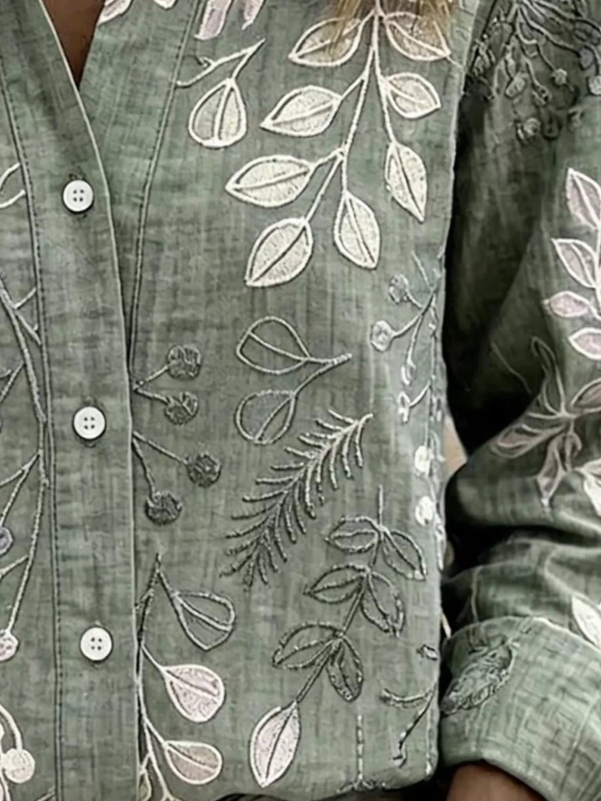 Green leaf-embroidered button-down shirt, leaf embroidery detail.