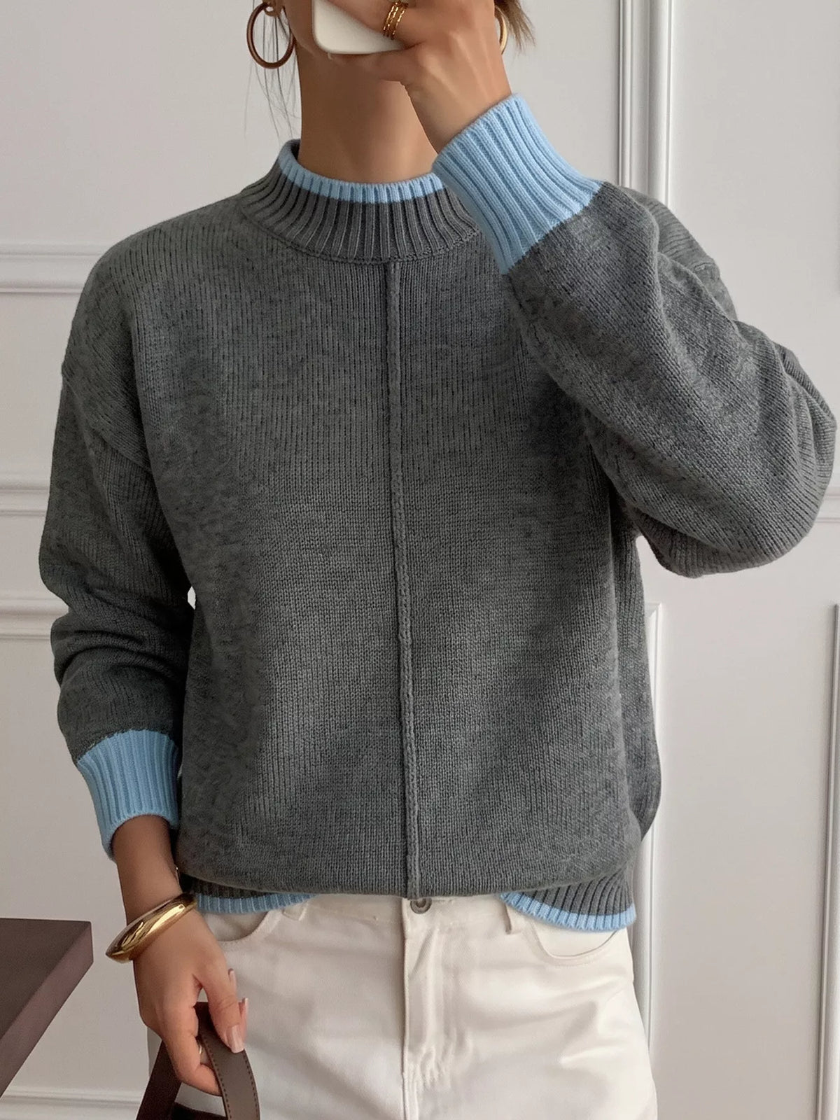 Gray sweater with blue contrast trim, cuff view