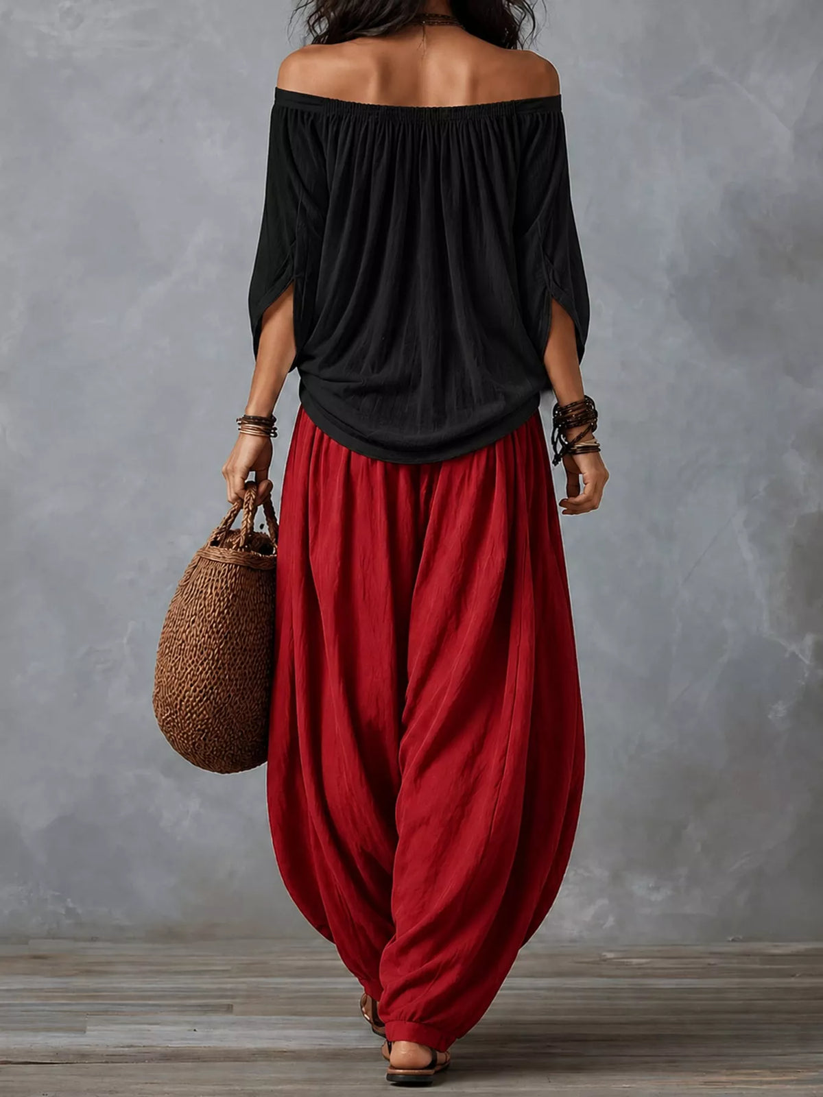 Black top and red pants off-shoulder top and wide-leg harem pants set — back view