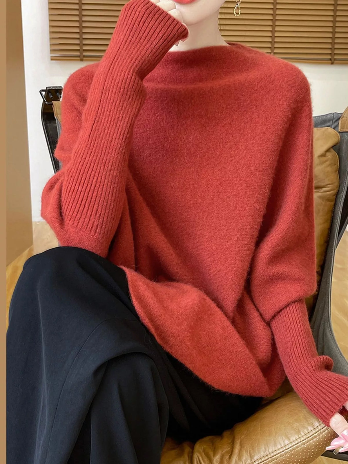 Red asymmetrical lantern sleeve sweater — front view