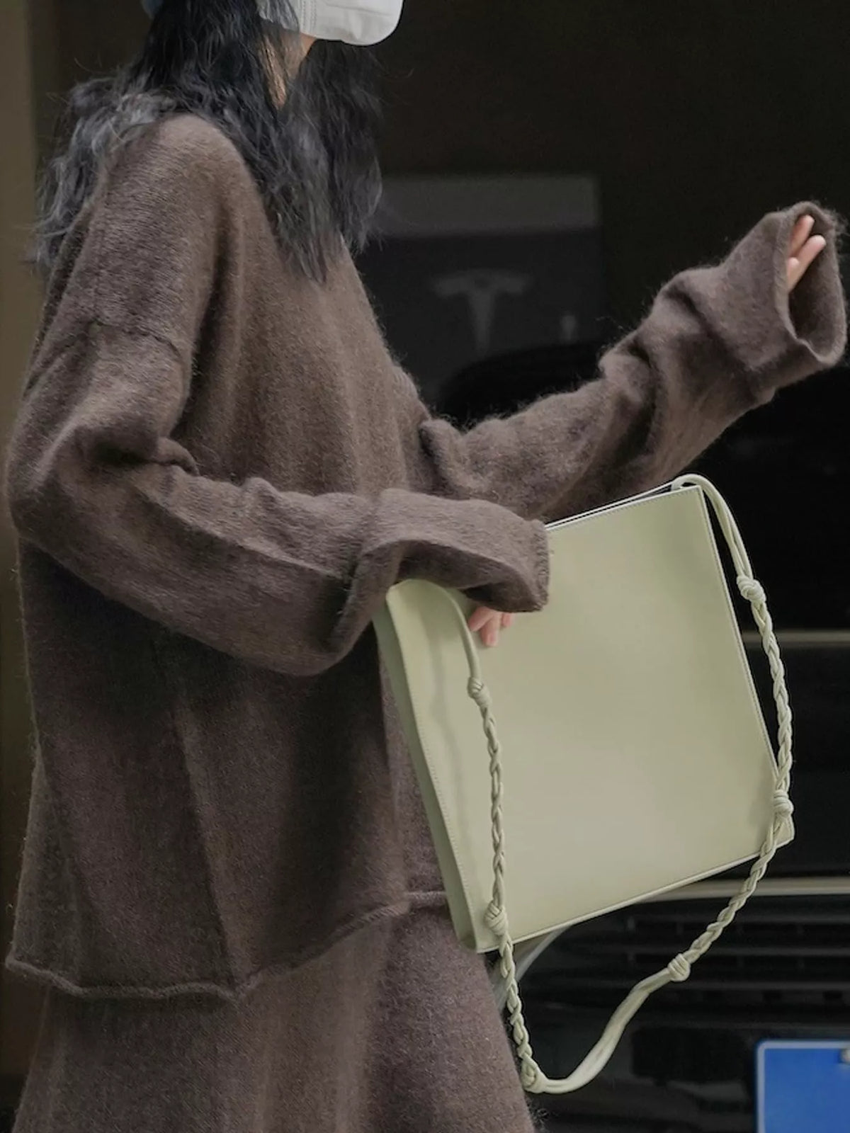 Brown round neck sweater, side view