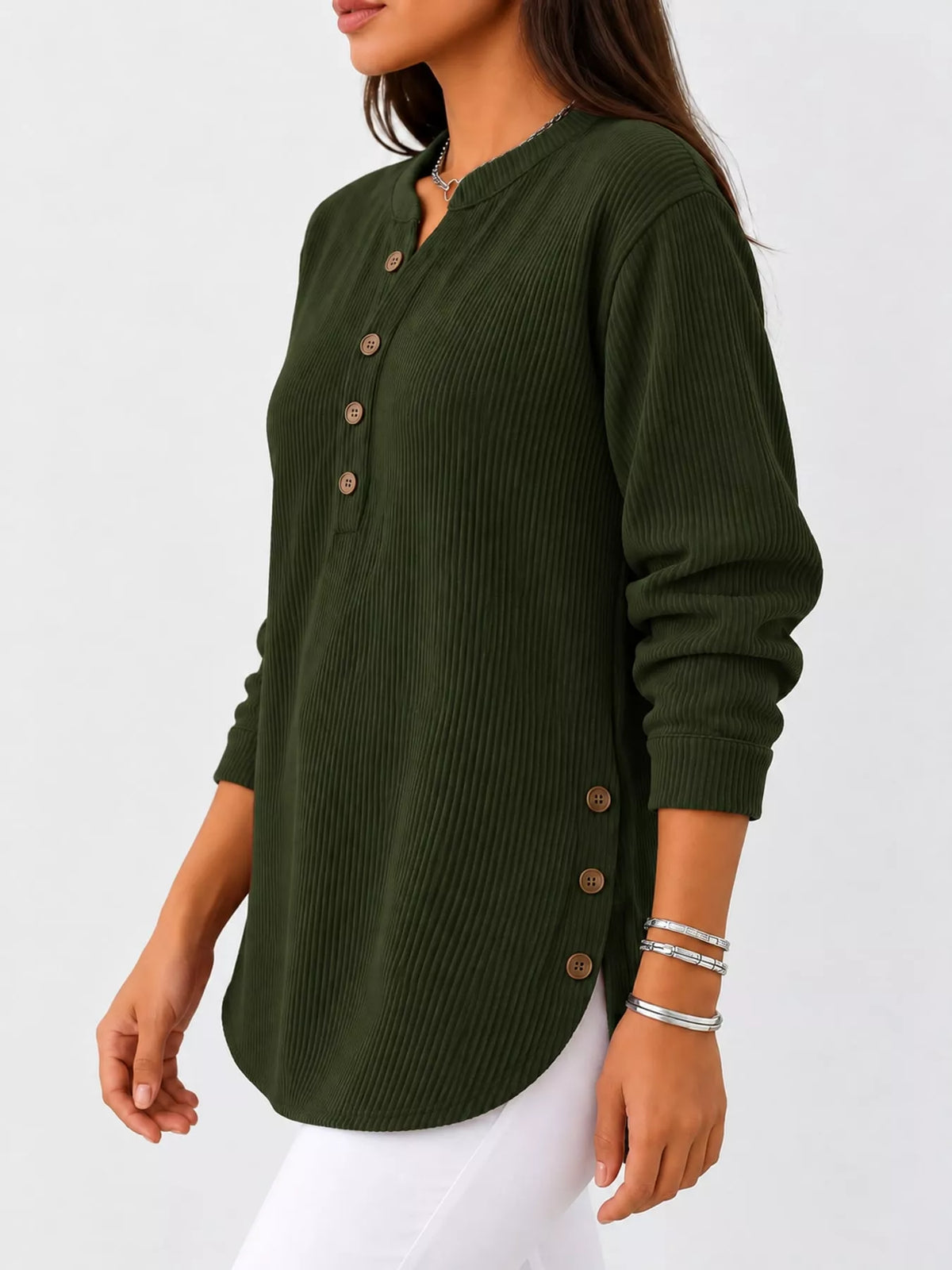 Green button detail long sleeve top, side view