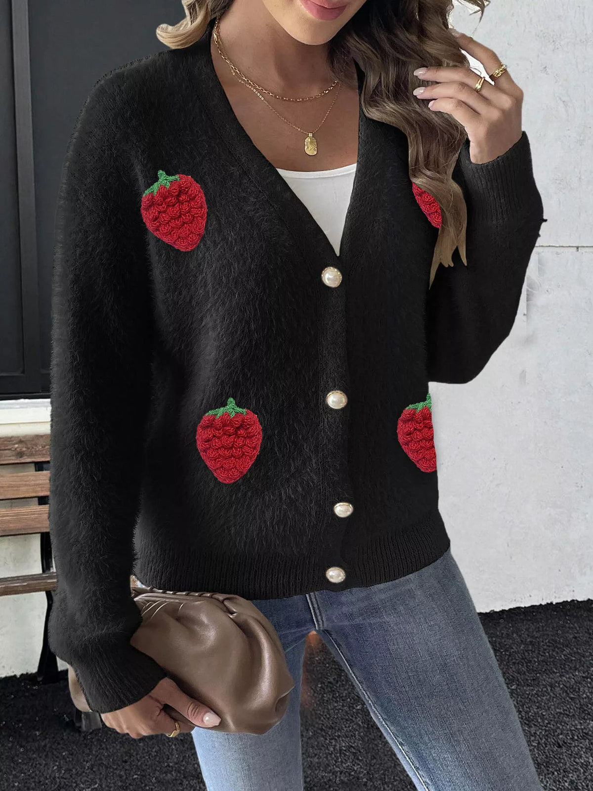 Black strawberry-applique cardigan, buttoned front view