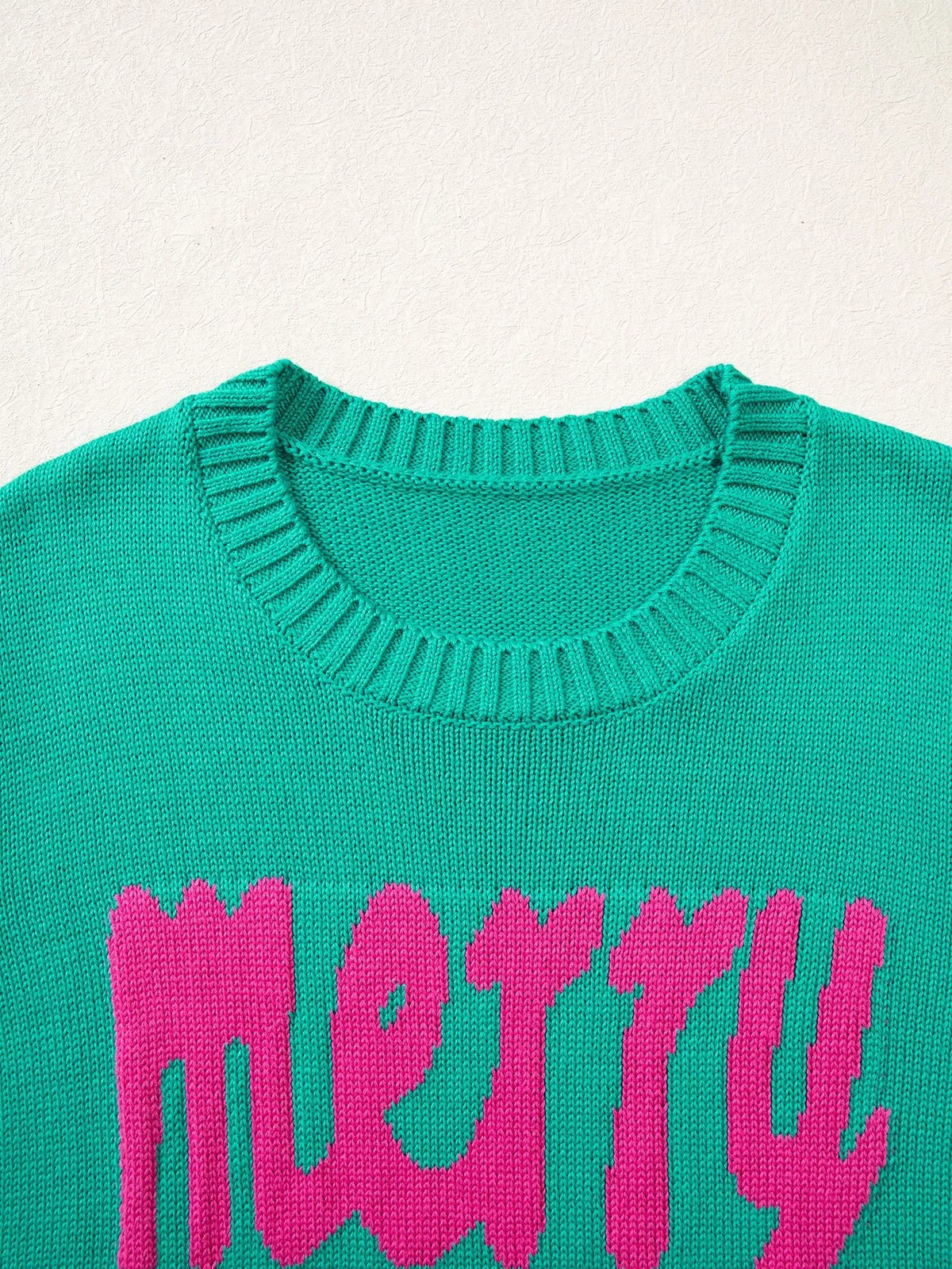 Merry sweater, green ribbed neckline and lettering