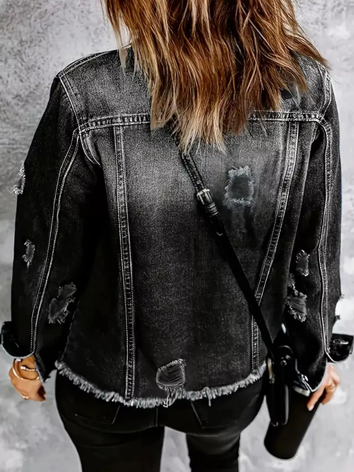 Women's Distressed Raw Hem Denim Jacket in black — back view