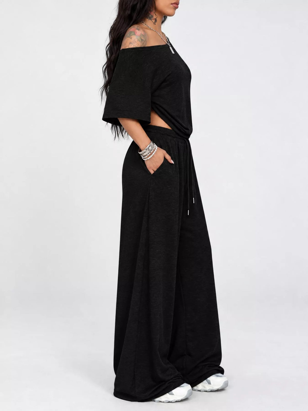Black boat neck top and wide-leg pants set — side view