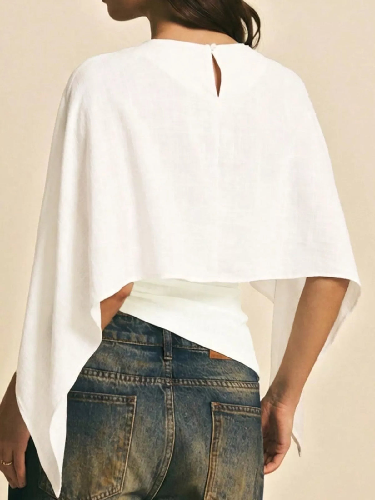 White cape sleeve round neck blouse, back view