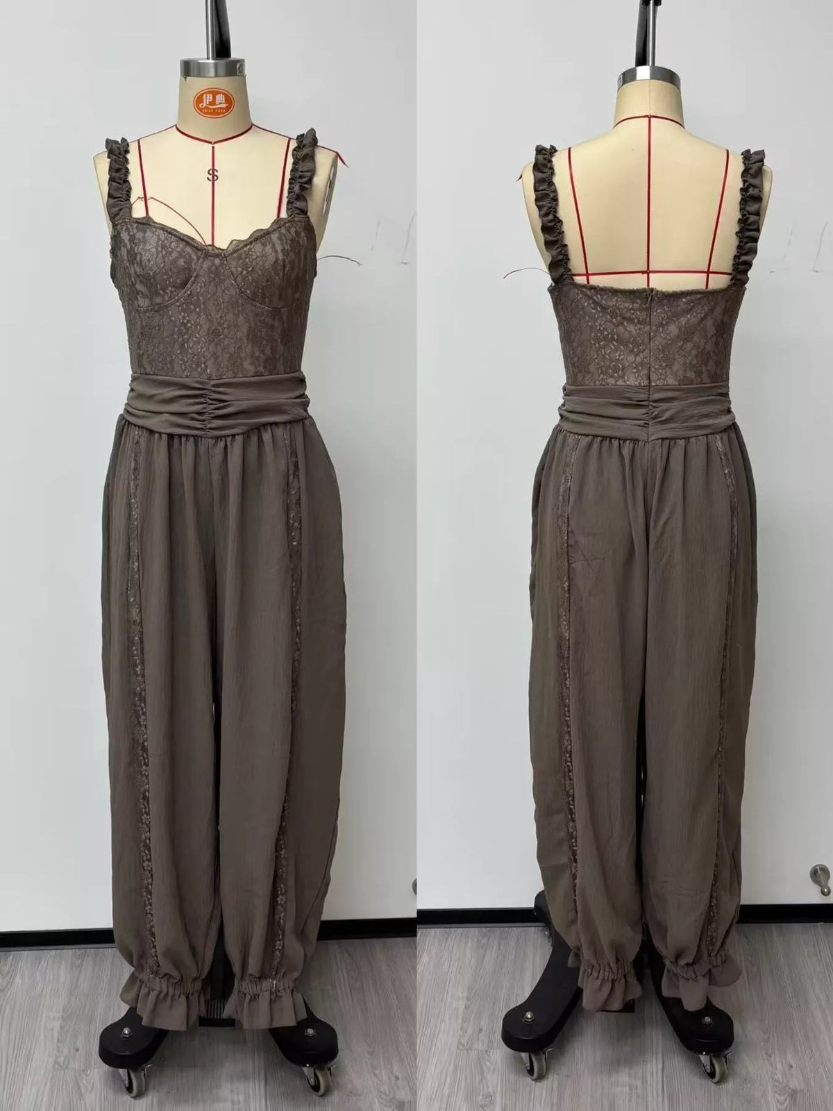 Taupe lace-bodice harem-leg jumpsuit, front and back on dress forms.