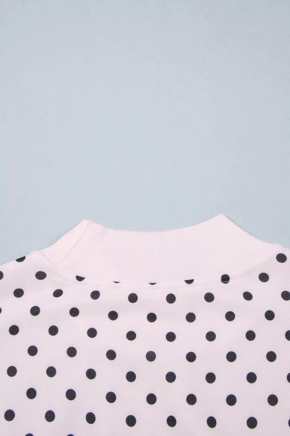 White polka dot mock neck sweatshirt, back view