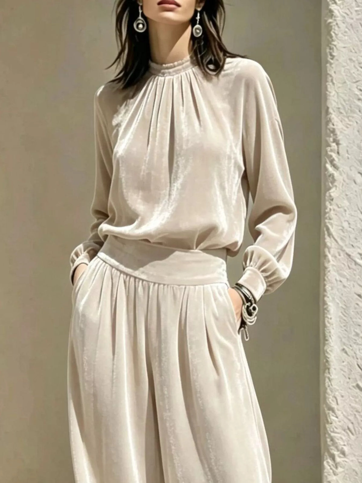 Cream velvet mock-neck top and pants set, neckline and waist detail