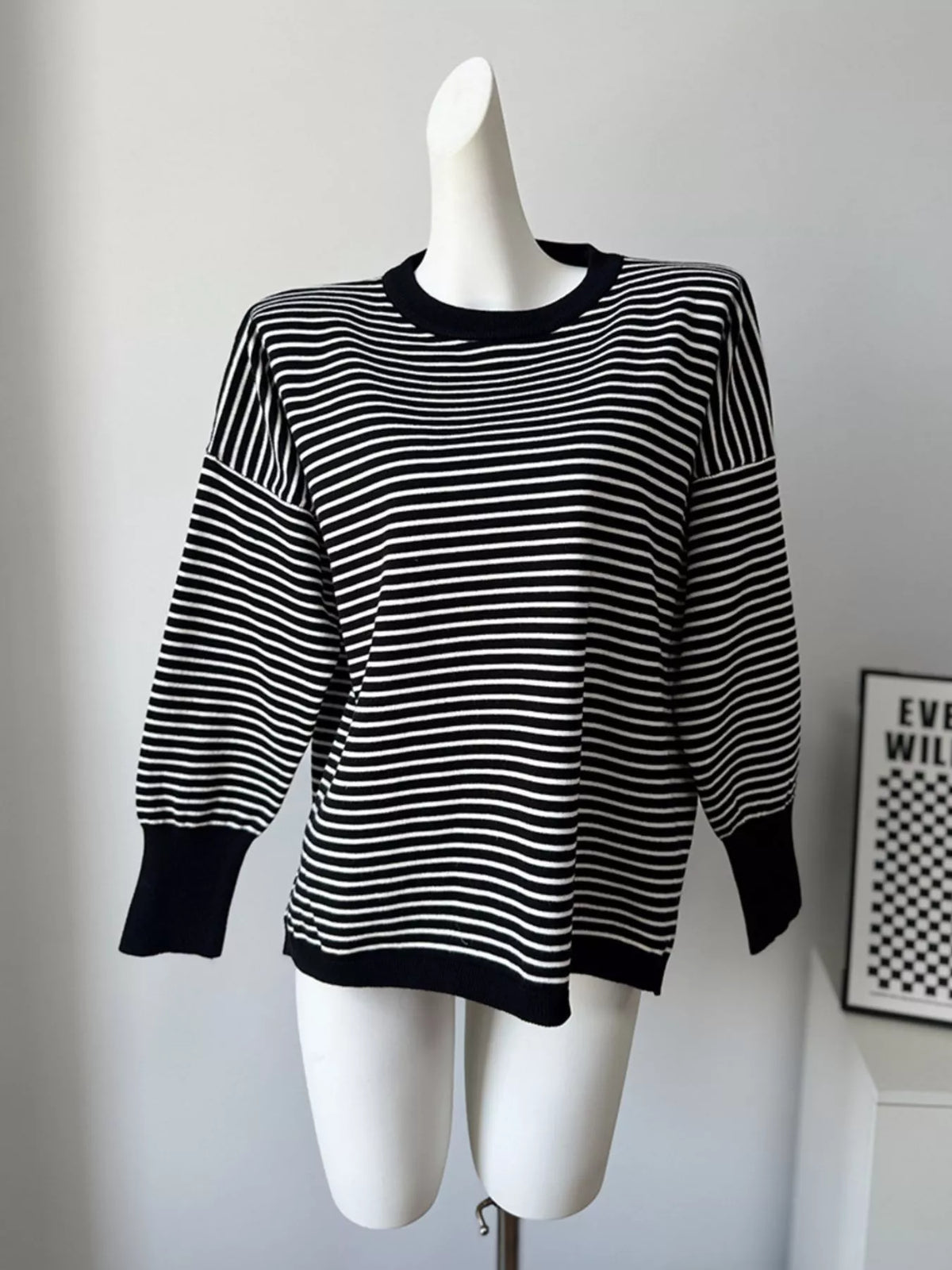 Striped round-neck knit top in black and white, front mannequin view
