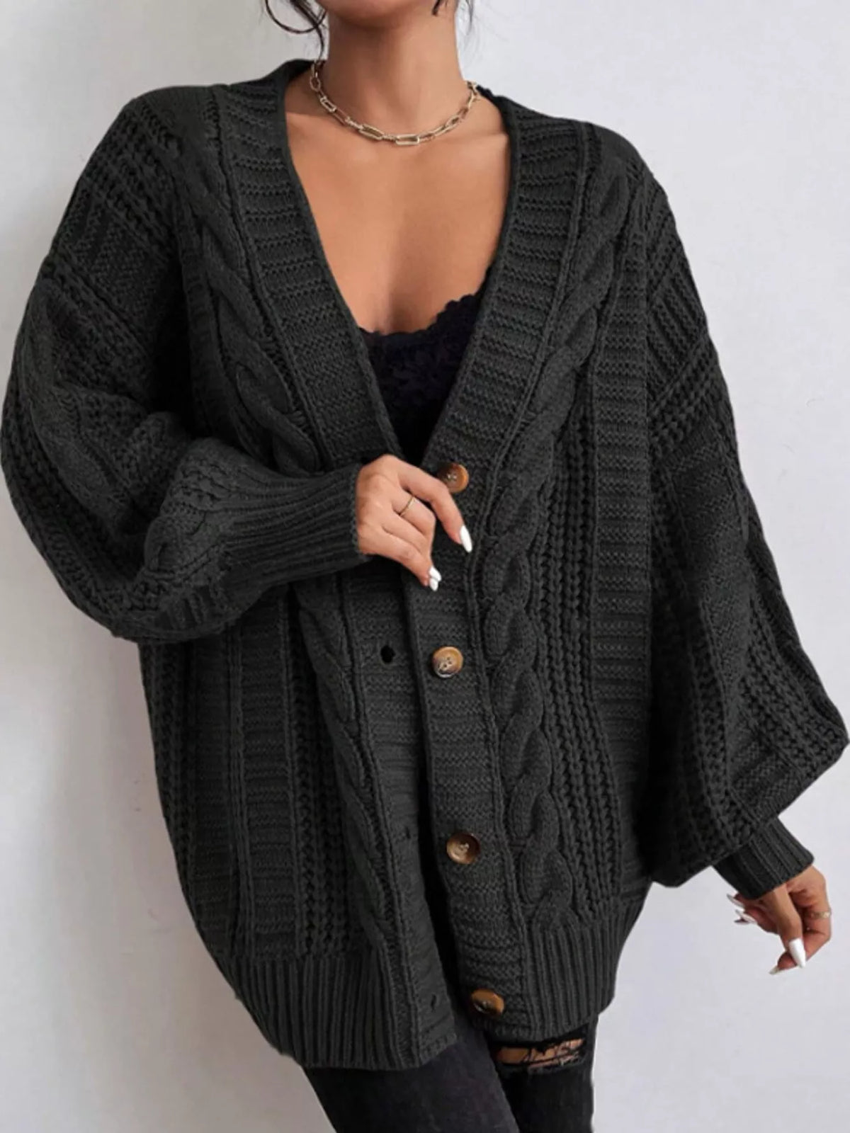 Black cable knit button-down cardigan